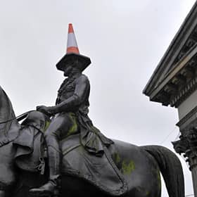 Glasgow is known for many things, including the traffic cone on the Duke of Wellington's statue. This year it could become synonymous with the fight against climate change (Picture: Andy Buchanan/AFP via Getty Images)