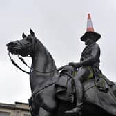 Glasgow is known for many things, including the traffic cone on the Duke of Wellington's statue. This year it could become synonymous with the fight against climate change (Picture: Andy Buchanan/AFP via Getty Images)