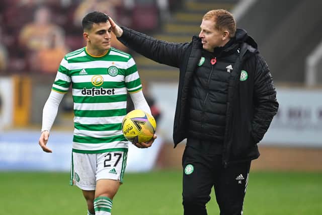 Mohamed Elyounoussi is congratulated by manager Neil Lennon after bagging a hat-trick against Motherwell. Picture: SNS