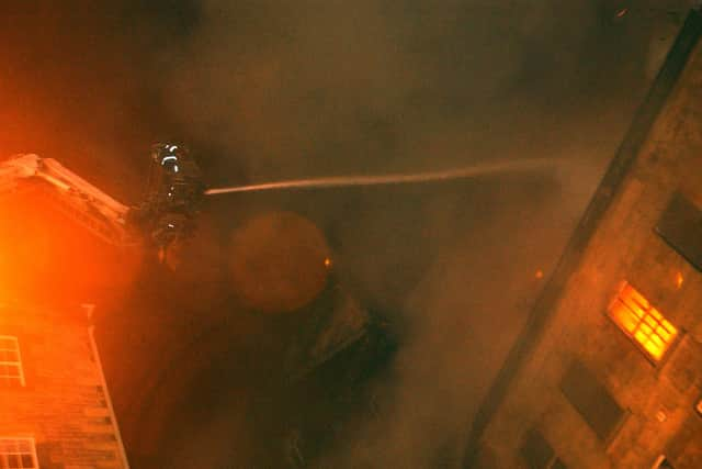 Firefighter tackles the blaze in Edinburgh's Cowgate    Pic: Tony Marsh