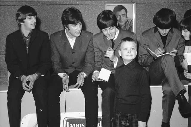 A young kilted fan gets to meet the Beatles at the ABC cinema in Edinburgh in 1964 - (l-r) Ringo Starr, John Lennon, Paul McCartney, George Harrison