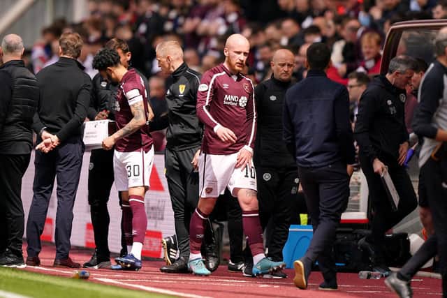 Hearts' Liam Boyce goes off injured during the cinch Premiership match against Rangers.