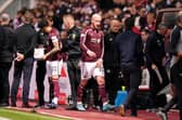 Hearts' Liam Boyce goes off injured during the cinch Premiership match against Rangers.