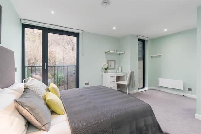 The master bedroom benefits from an en-suite bathroom and offers views of Edinburgh Castle