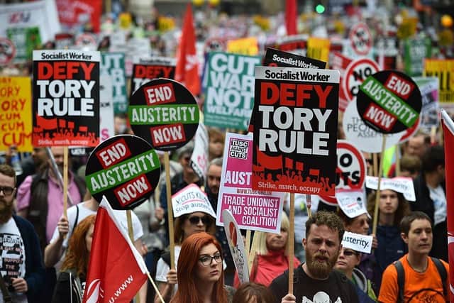 Demonstrators march to protest against the British government's spending cuts and austerity measures in London on June 20, 2015. Picture: BEN STANSALL/AFP via Getty Images