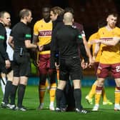 Hearts manager Robbie Neilson speaks to referee Willie Collum after the 2-0 defeat to Motherwell (Photo by Craig Foy / SNS Group)