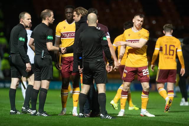 Hearts manager Robbie Neilson speaks to referee Willie Collum after the 2-0 defeat to Motherwell (Photo by Craig Foy / SNS Group)