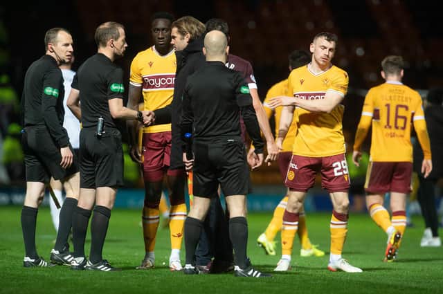 Hearts manager Robbie Neilson speaks to referee Willie Collum after the 2-0 defeat to Motherwell (Photo by Craig Foy / SNS Group)