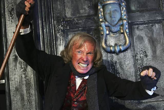 The character of Ebenezer Scrooge, as depicted by Tommy Steele here, was supposedly based on a name on an Edinburgh gravestone (Picture: MJ Kim/Getty Images)