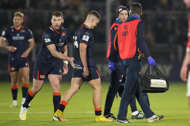 Edinburgh's Darcy Graham goes off injured against Munster. (Photo by Simon Wootton / SNS Group)