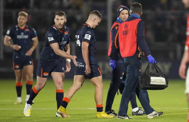 Edinburgh's Darcy Graham goes off injured against Munster. (Photo by Simon Wootton / SNS Group)