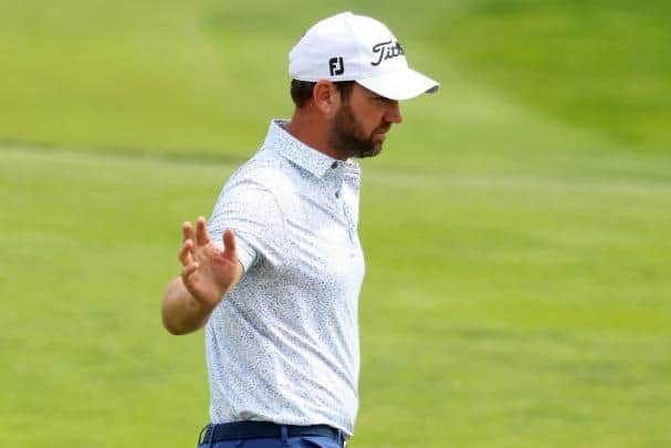 Scott Jamieson acknowledges the crowd after making his eagle-3 on the 18th hole. Picture: Andrew Redington/Getty Images.