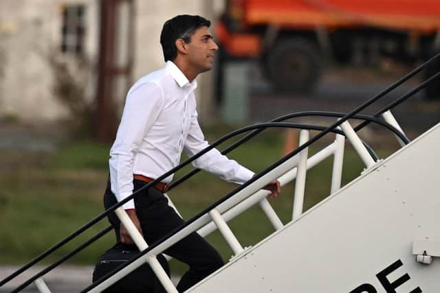 Prime Minister Rishi Sunak boards a plane to travel to the G20 meeting in Bali. Picture: Leon Neal/Pool via AP
