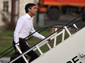 Prime Minister Rishi Sunak boards a plane to travel to the G20 meeting in Bali. Picture: Leon Neal/Pool via AP