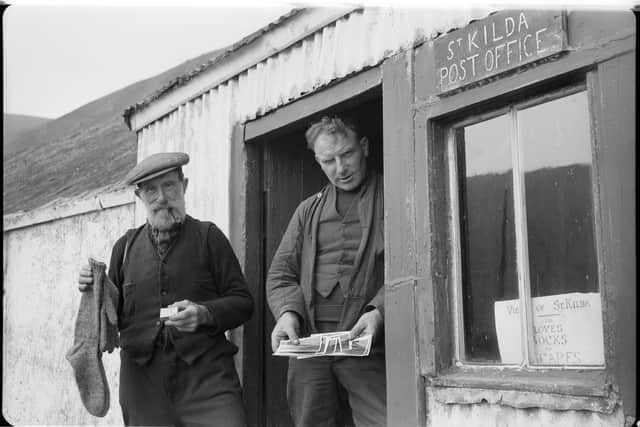 Finlay MacQueen & Neil Gillies  at the post office with items for sale for passing  cruiseship passengers. Photo by Robert Atkinson (c) University of Edinburgh. Robert Atkinson Collection, School of Scottish Studies Archives (SSSA RA-Coll S316)