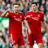 Andy Considine, left, and Scott McKenna in action for Aberdeen.