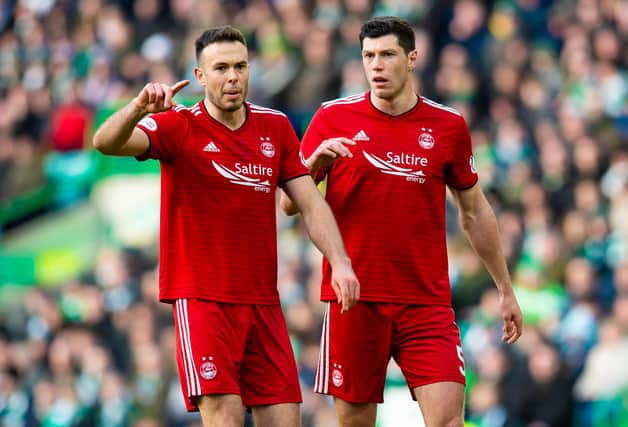 Andy Considine, left, and Scott McKenna in action for Aberdeen.