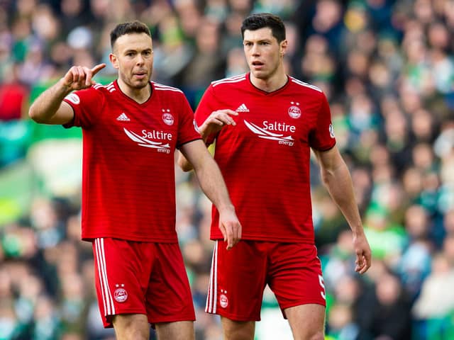 Andy Considine, left, and Scott McKenna in action for Aberdeen.