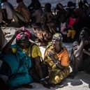 Refugees who have fled from the war in Sudan line up during a cash assistance programme at a transit centre for refugees in South Sudan earlier this year.