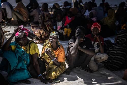 Refugees who have fled from the war in Sudan line up during a cash assistance programme at a transit centre for refugees in South Sudan earlier this year.