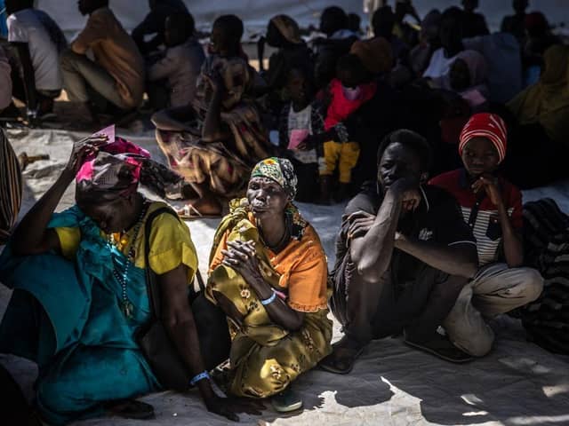 Refugees who have fled from the war in Sudan line up during a cash assistance programme at a transit centre for refugees in South Sudan earlier this year.