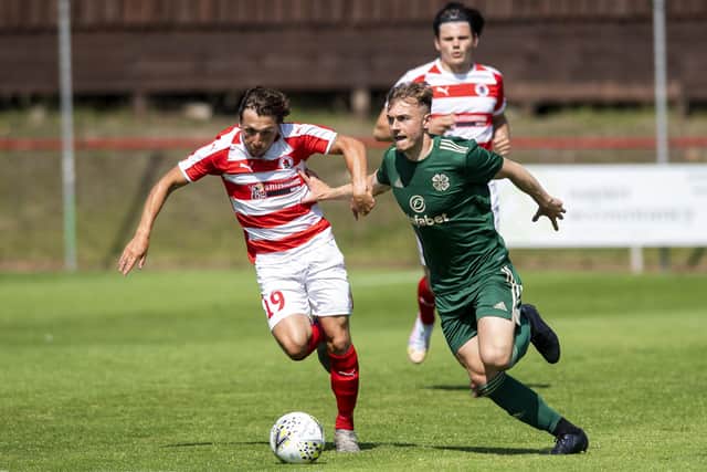 Ross Gray of Bonnyrigg Rose and Celtic's Brody Patterson in action during the Lowland League opener at New Dundas Park. Picture: Mark Scates: SNS Group