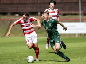 Ross Gray of Bonnyrigg Rose and Celtic's Brody Patterson in action during the Lowland League opener at New Dundas Park. Picture: Mark Scates: SNS Group