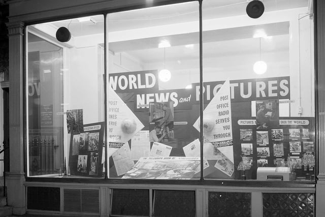 This window of a shop at 118 George Street featured a display of photographs from The Scotsman publicising the work of Post Office Radio in delivering pictures to the newspaper. The picture was taken in November 1961.