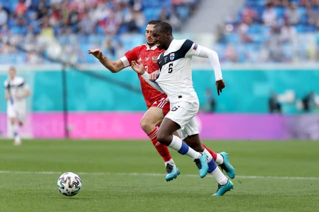 Rangers midfielder Glen Kamara battles for possession with Magomed Ozdoev during Finland's Euro 2020 Group B clash with Russia in St Petersburg on Wednesday afternoon. (Photo by Joosep Martinson - UEFA/UEFA via Getty Images)