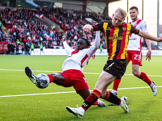 Airdrie's Kanayo Megwa and Partick Thistle's Harry Milne in action during the cinch Premiership play-off quarter final first leg.