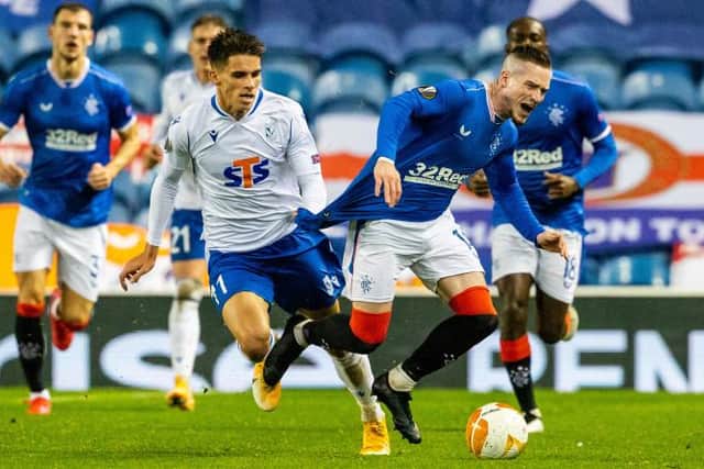 Rangers winger Ryan Kent is dragged back off the ball by Filip Marchwinski of Lech Poznan in the Europa League Group D match at Ibrox. (Photo by Alan Harvey / SNS Group)