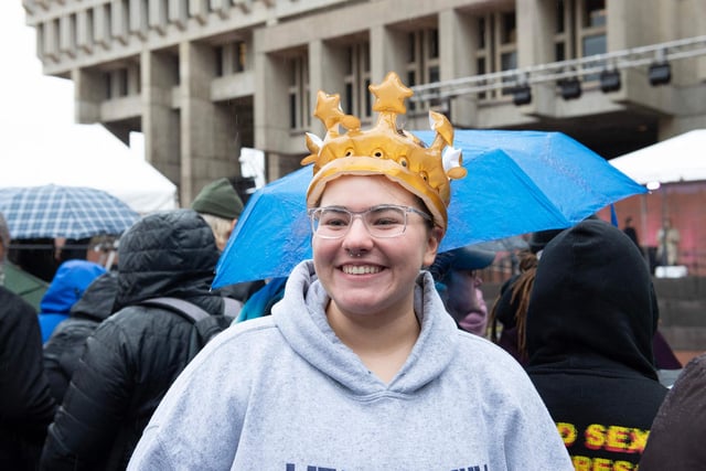 A royal fan wears an inflatable crown.