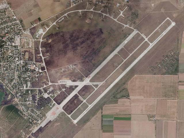 A satellite image by Planet Labs PBC shows Saky Air Base after an explosion there Wednesday, Aug. 10, 2022 woth scorch marks visible and extensive damage.
