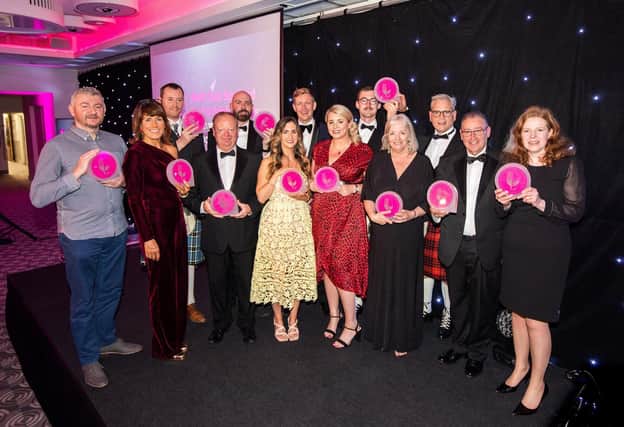 The award winners celebrate their success.