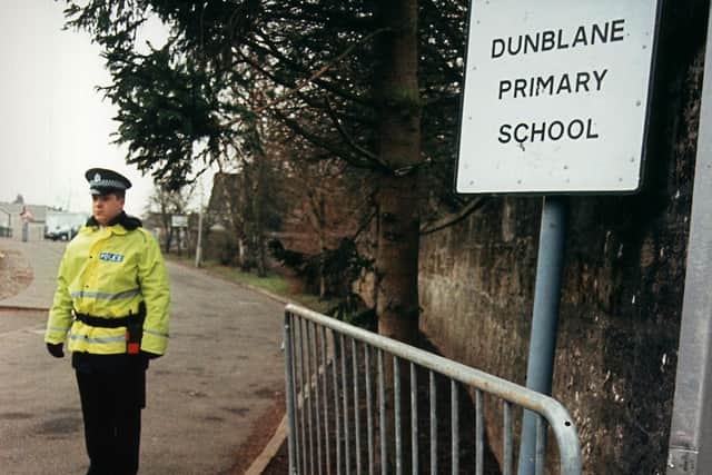 Flowers are laid at the gates of Dunblane Primary School where 16 children and their teacher were shot by Thomas Hamilton (Getty Images)