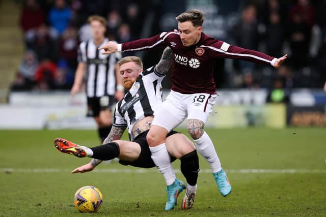 Alan Power (L) tackles Hearts' Barrie McKay at SMiSA Stadium, on Saturday.  (Photo by Alan Harvey / SNS Group)