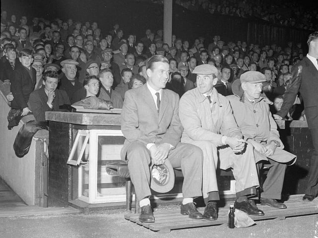 Willie Bauld watches his Hearts v Sheffield testimonial game from the trainers' bench at Tynecastle in 1962.