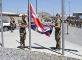 Soldiers from the Black Watch lower the Union flag in Afghanistan (Picture: Ministry of Defence)