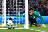 PSV goalkeeper Walter Benitez lets the ball slip over the line from Tom Lawrence's free kick to make it 2-1 to Rangers.