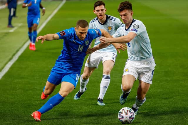 Israel's forward Shon Weissman (L) is marked by Scotland's defender Kieran Tierney (R) during the 2022 FIFA World Cup qualifier group F football match between Israel and Scotland at Bloomfield Stadium. (Photo by JACK GUEZ/AFP via Getty Images)