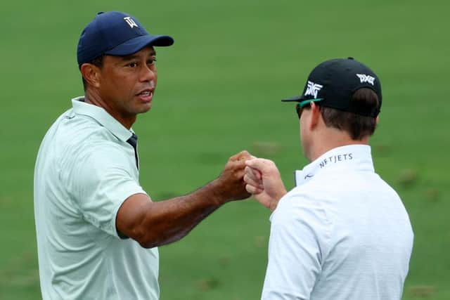 Tiger Woods greets US Ryder Cup captain Zach Johnson on the range prior to The Masters at Augusta National Golf Club. Picture: Andrew Redington/Getty Images.