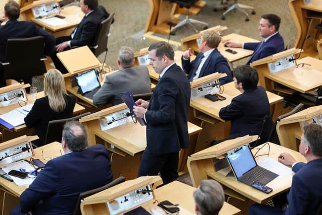 Douglas Ross collects his belongings after being is asked to leave the chamber by the Presiding Officer Alison Johnstone during First Minister's Questions last week  (Picture: Jeff J Mitchell/Getty Images)