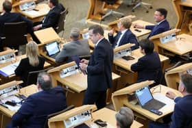 Douglas Ross collects his belongings after being is asked to leave the chamber by the Presiding Officer Alison Johnstone during First Minister's Questions last week  (Picture: Jeff J Mitchell/Getty Images)