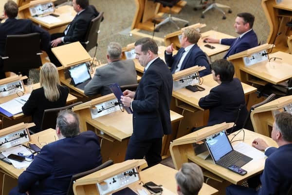 Douglas Ross collects his belongings after being is asked to leave the chamber by the Presiding Officer Alison Johnstone during First Minister's Questions last week  (Picture: Jeff J Mitchell/Getty Images)