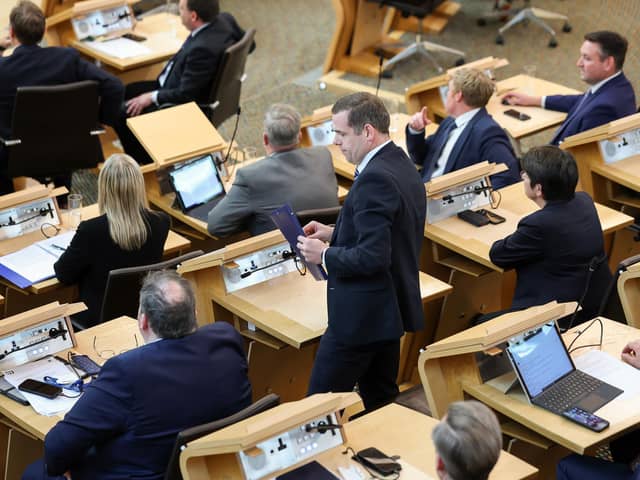 Douglas Ross collects his belongings after being is asked to leave the chamber by the Presiding Officer Alison Johnstone during First Minister's Questions last week  (Picture: Jeff J Mitchell/Getty Images)