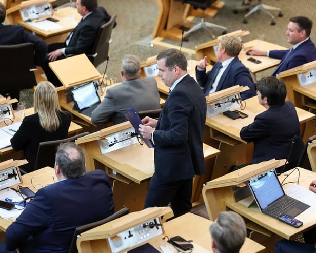 Douglas Ross collects his belongings after being is asked to leave the chamber by the Presiding Officer Alison Johnstone during First Minister's Questions last week  (Picture: Jeff J Mitchell/Getty Images)