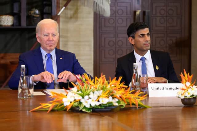 NUSA DUA, INDONESIA - NOVEMBER 16: U.S. President Joe Biden (L) and British Prime Minister Rishi Sunak attend an meeting of leaders at the G20 summit after a missile landed in Poland near the Ukrainian border, on November 16, 2022 in Nusa Dua, Indonesia. The G20 meetings are being held in Bali from November 15-16. (Photo by Leon Neal/Getty Images,)