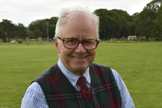 Leith Rules Golf Society president John Dixon shows off the feathery ball he hit at Leith Links.