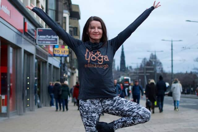 Allison Harrison doing tree pose on Princes Street Pic: Oliver Buchanan