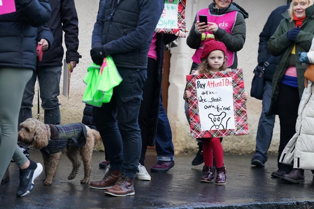 Ella Limardi, 5, joins striking teachers from the EIS to gather on the anniversary of Robert Burns' birth in 1759 outside the cottage in Alloway, Ayrshire, where he was born, as a rolling programme of regional action reaches its halfway point, with teachers in both South Ayrshire and Edinburgh taking strike action in a dispute over pay.